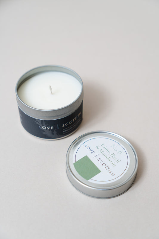 Lime Basil and Mandarin Travel Tin Candle on a white background