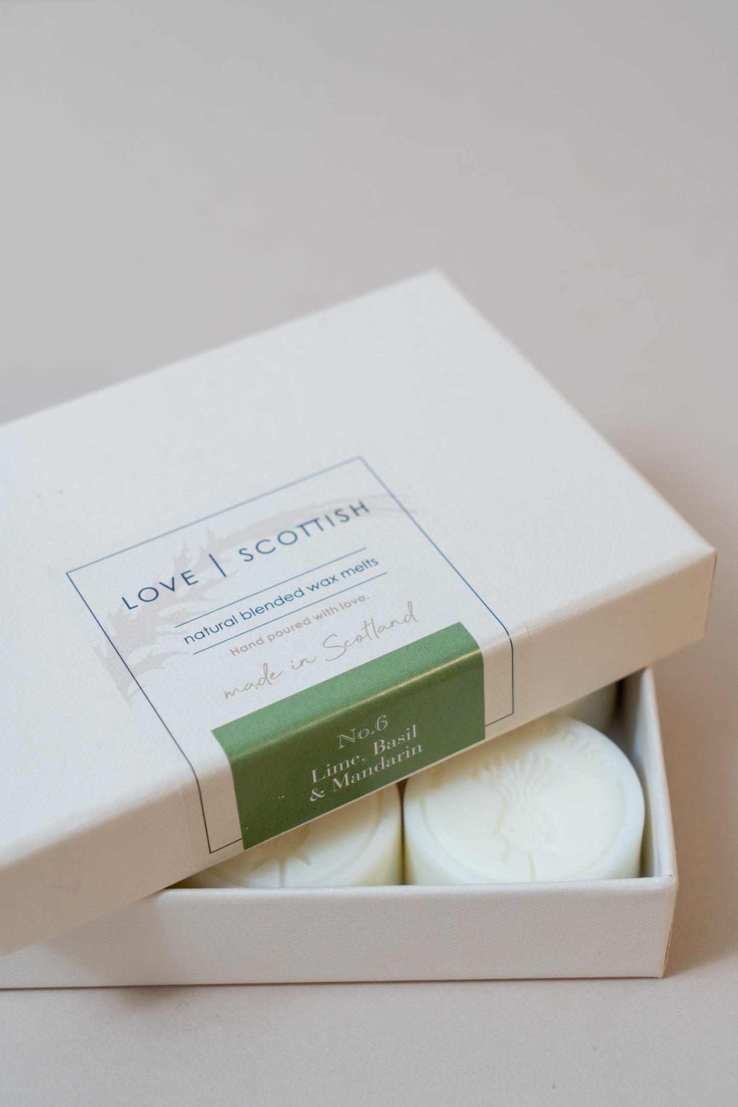 Lime Basil and Mandarin Wax Melts on a White Background
