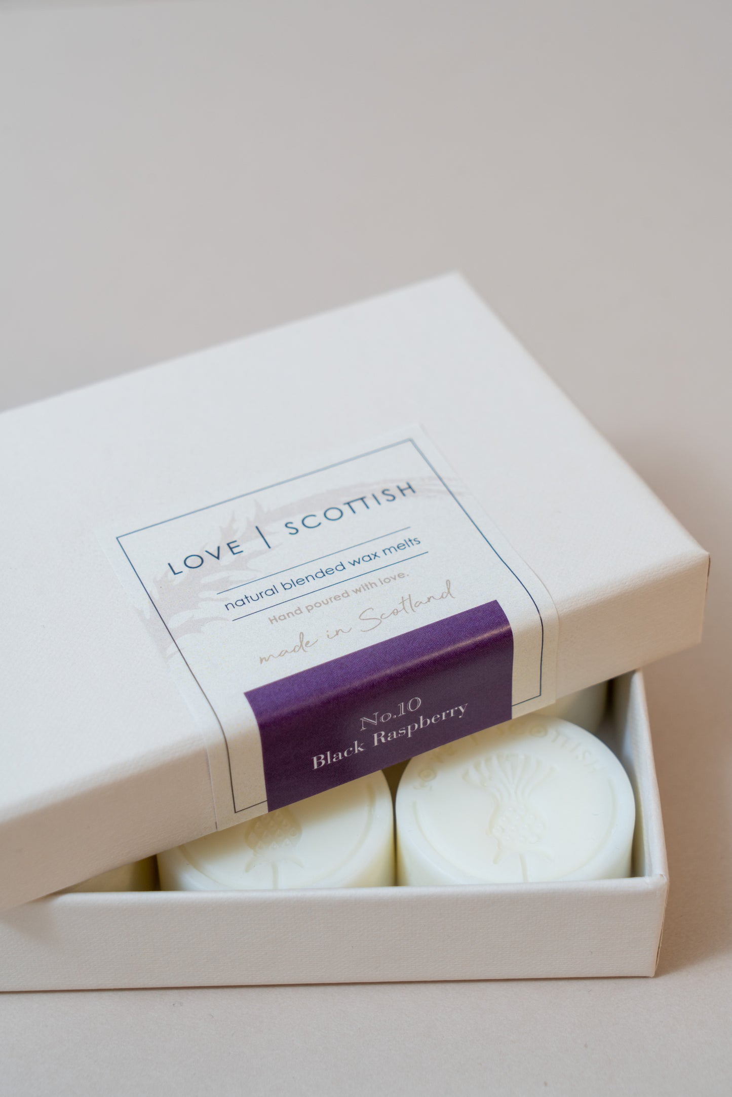 Black Pomegranate Wax Melts on a white Background