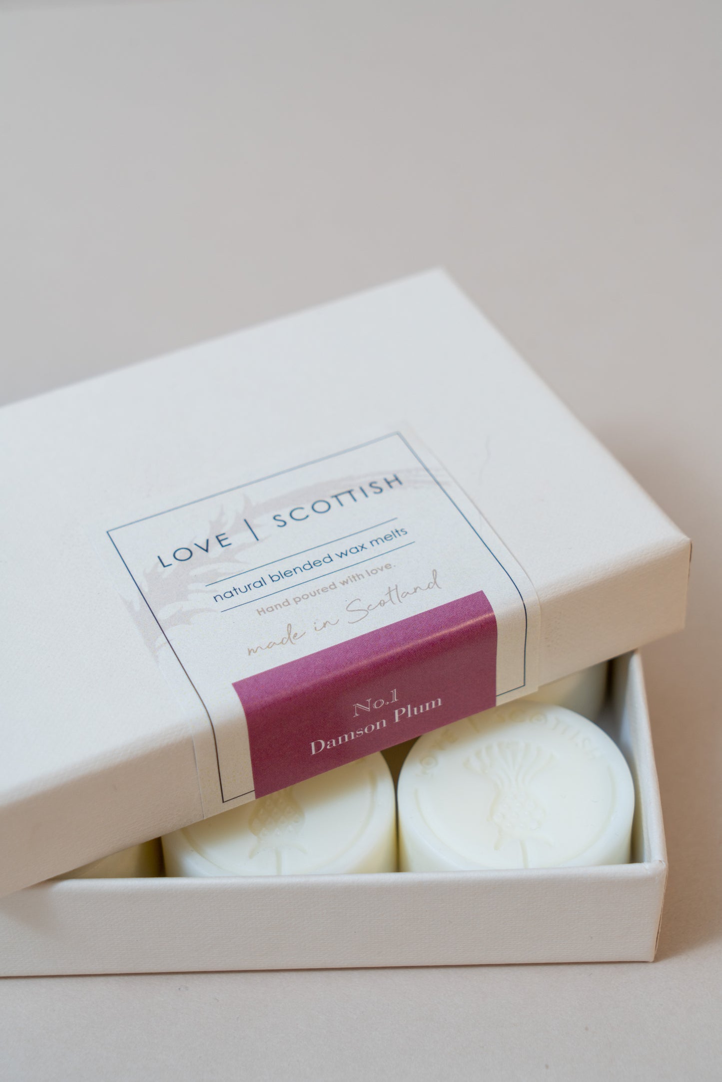 Damson Plum Wax Melts on a White Background
