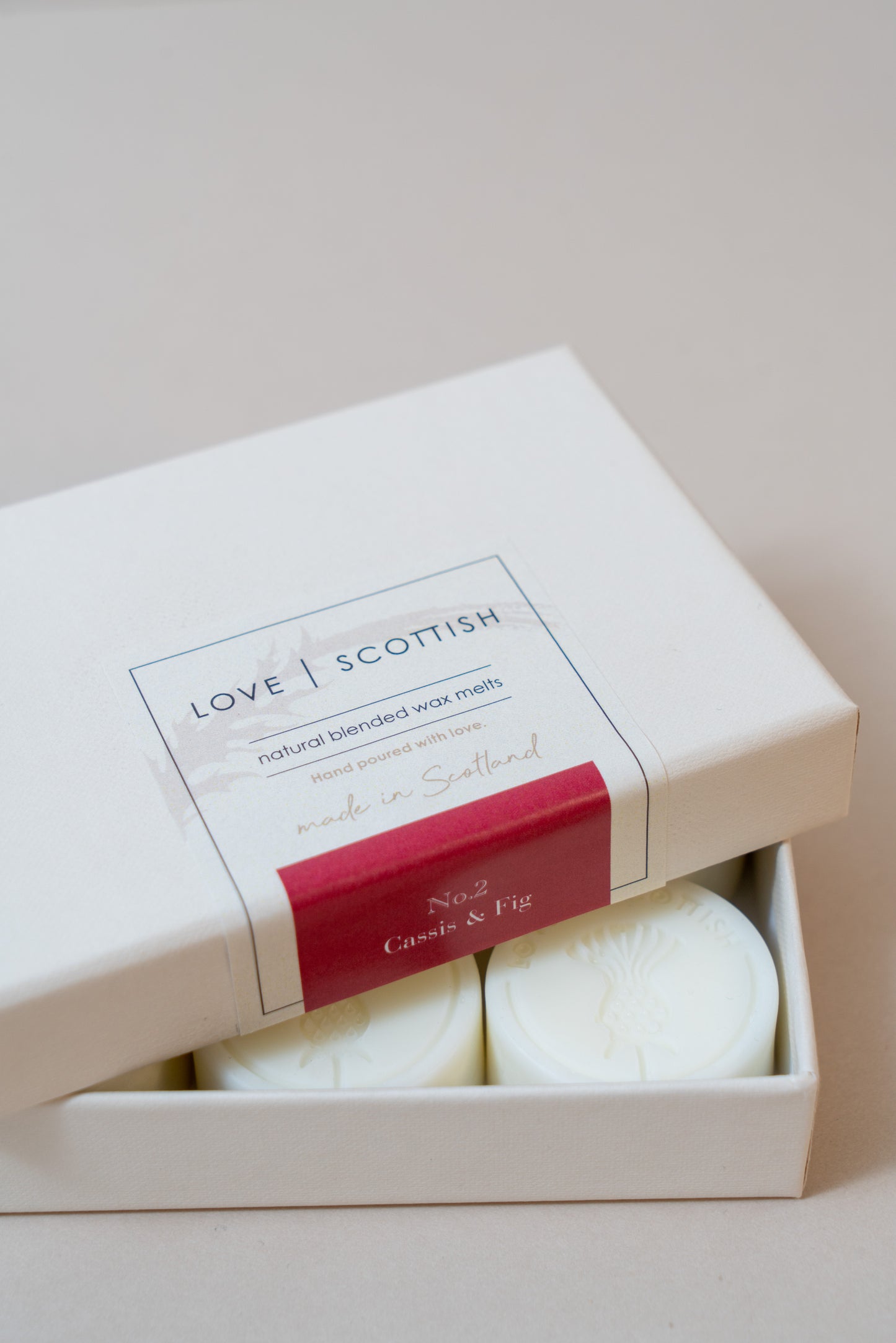 Cassis and Fig Wax Melts on a white Background