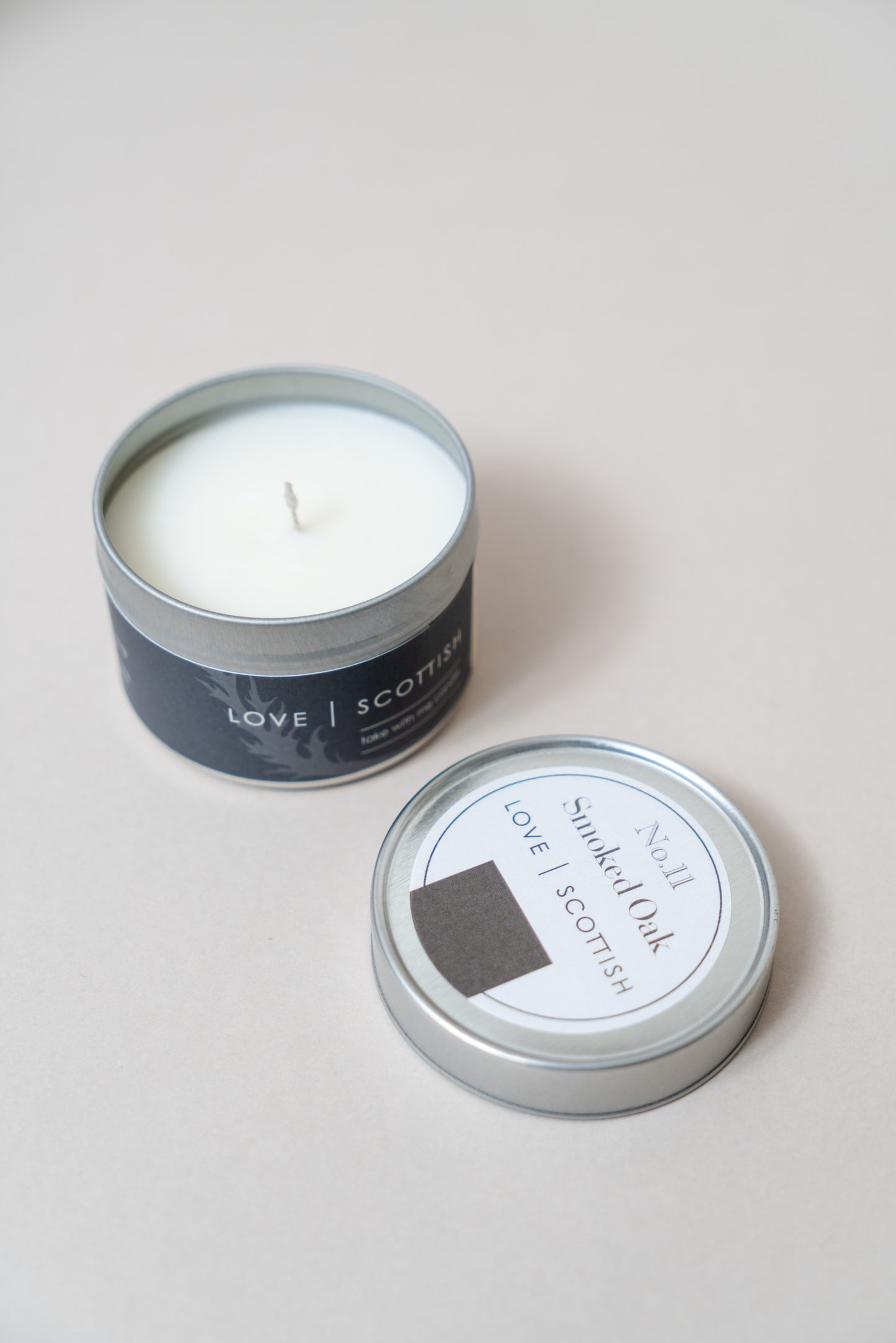 Smoked Oak Travel Tin Candle on a white background