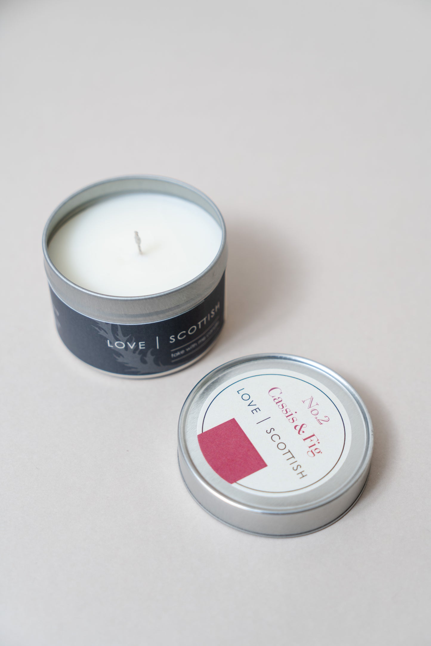 Cassis and Fig Travel Tin Candle on a white background
